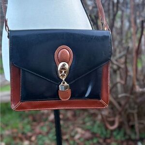Vintage Marchino leather crossbody bag with classic envelope flap design.